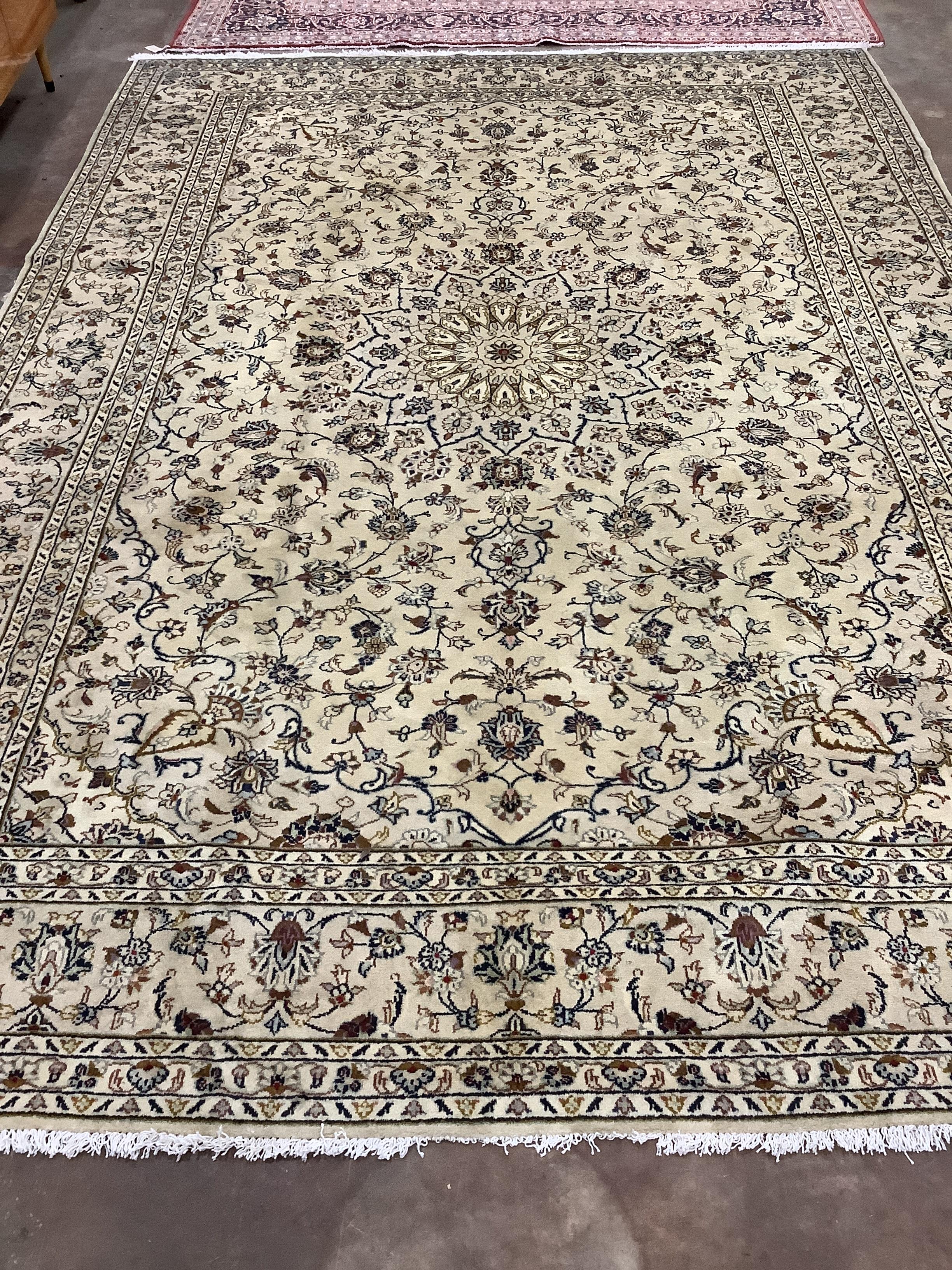 A Kashan ivory ground carpet, 348 x 244cm
